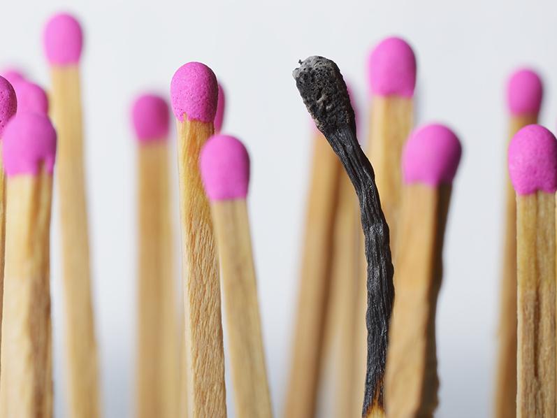 Pink topped wooded matches with one match burned out