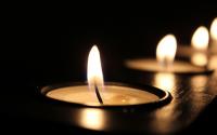 Lit candles on a dark background